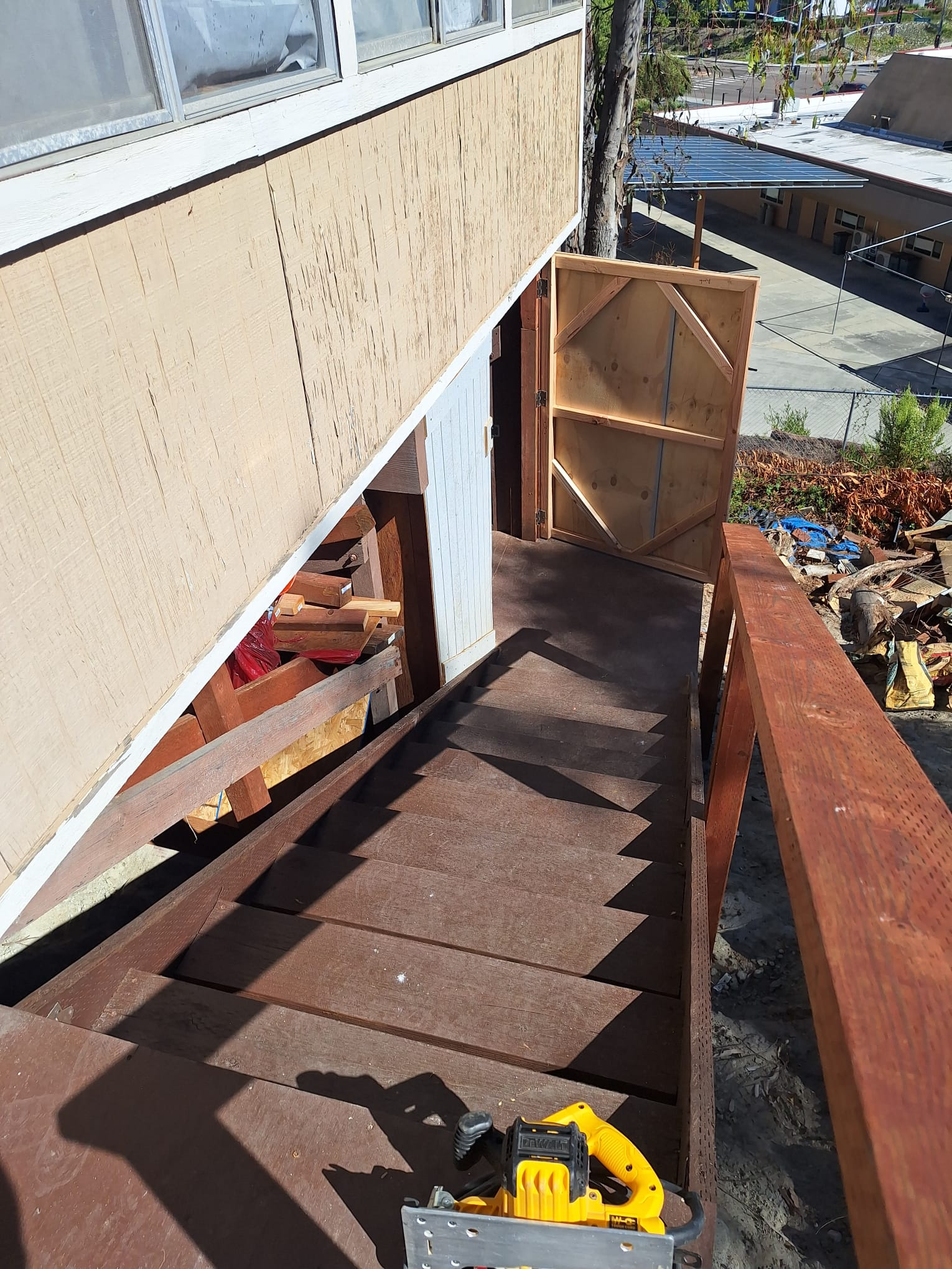 Exterior stairs and gate under construction