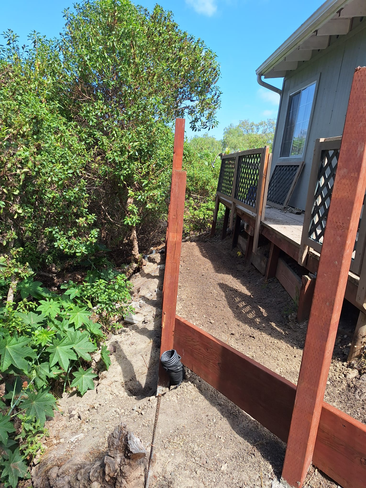 Support posts set in concrete footings during construction
